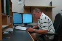 Clint working at his desk